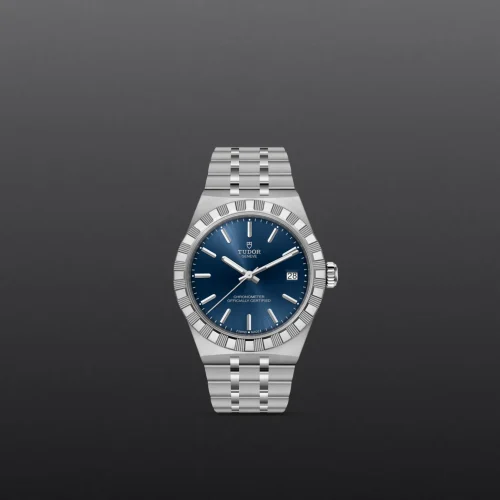 Silver Tudor wristwatch with a blue dial and date window at 3 o'clock on a dark gradient background