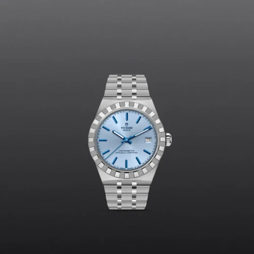 Tudor wristwatch with a light blue dial and stainless steel bracelet against a dark gray background.