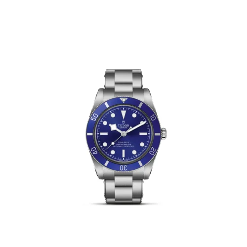 Stainless steel Tudor diver's watch with a blue bezel and blue dial on a metal bracelet.