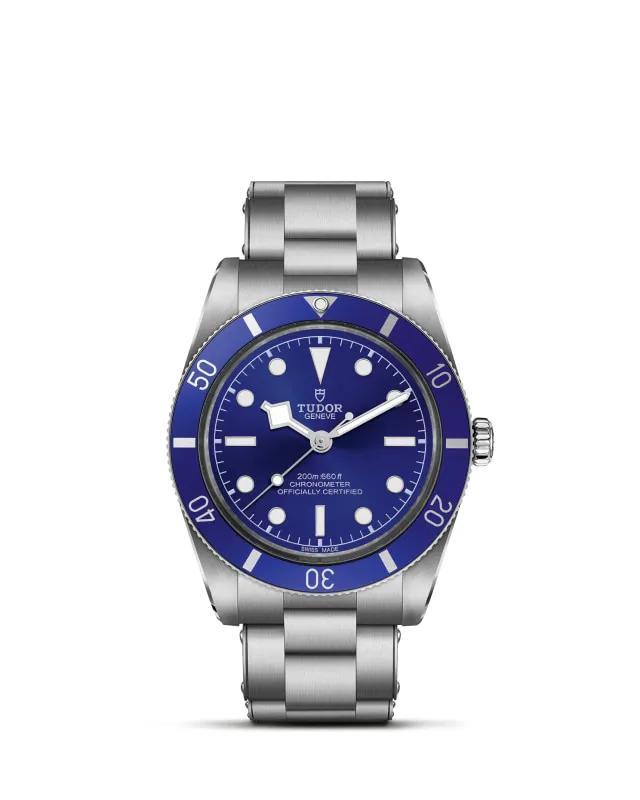 m79000b-0001_upright-wh-std-grid | Brela | Brela Stainless steel Tudor dive watch with blue dial and blue bezel on a metal bracelet, white hour markers and crown on the right side, against a white background. | Brela | Brela