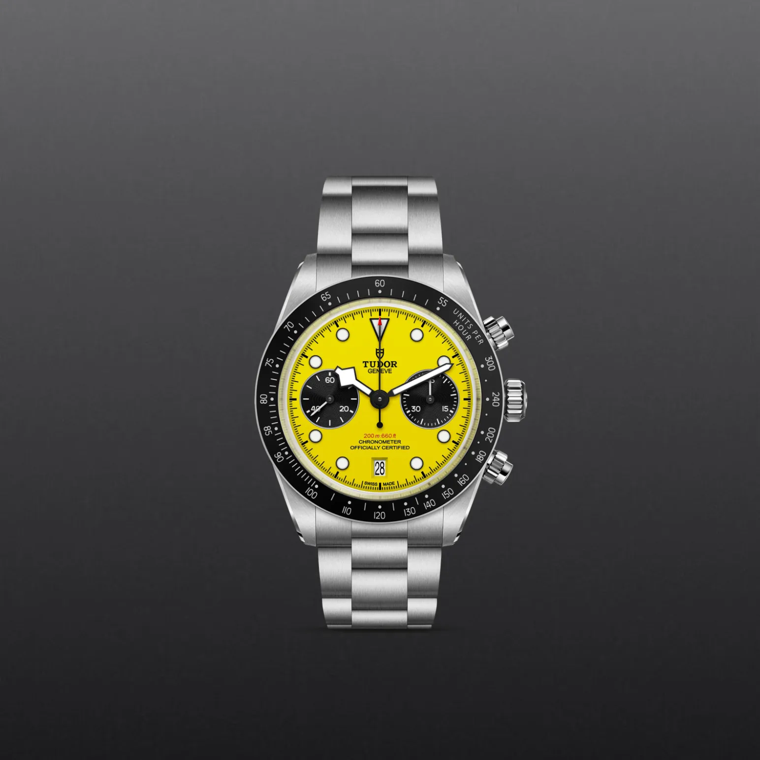 m79310n-0001-upright_watch_grey_background-model_page_only_standard_size | Brela Stainless steel wristwatch with a bright yellow dial and black subdials, Tudor branding visible, and a metal bracelet against a dark gray background | Brela