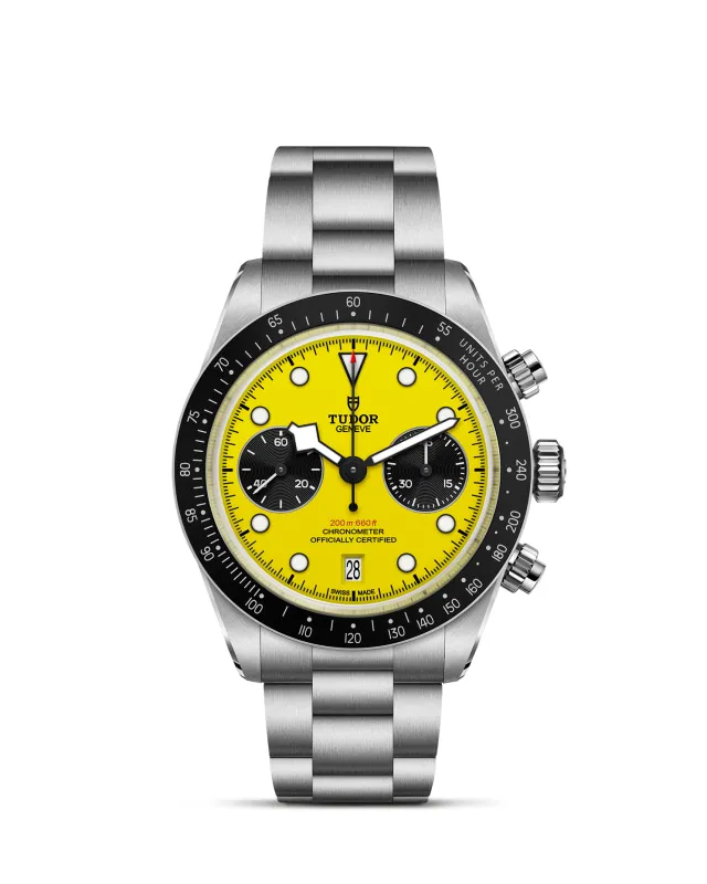 m79310n-0001_upright-wh-std-grid | Brela | Brela Stainless steel Tudor chronograph watch with a bright yellow dial, black subdials, date window, and a black tachymeter bezel. | Brela | Brela