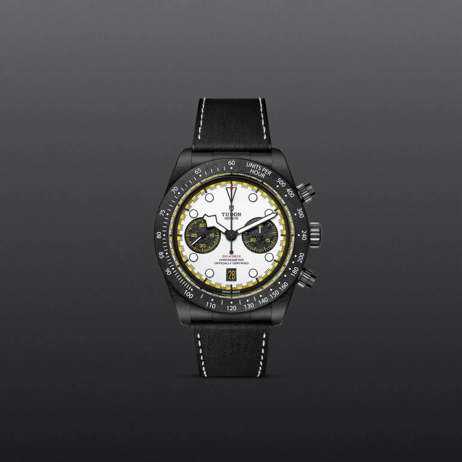m79377kn-0003-upright_watch_grey_background-model_page_only_standard_size | Brela Black Tudor chronograph wristwatch with white dial, yellow accents, and black strap against a dark gradient background. | Brela
