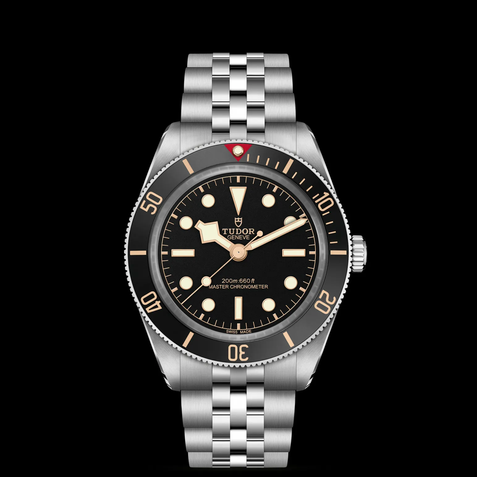 m7939a1a0nu-0001-upright_watch_black_background_zoomed_in | Brela Close-up of a Tudor dive watch with a black dial, gold markers, and stainless steel bracelet on a black background. | Brela