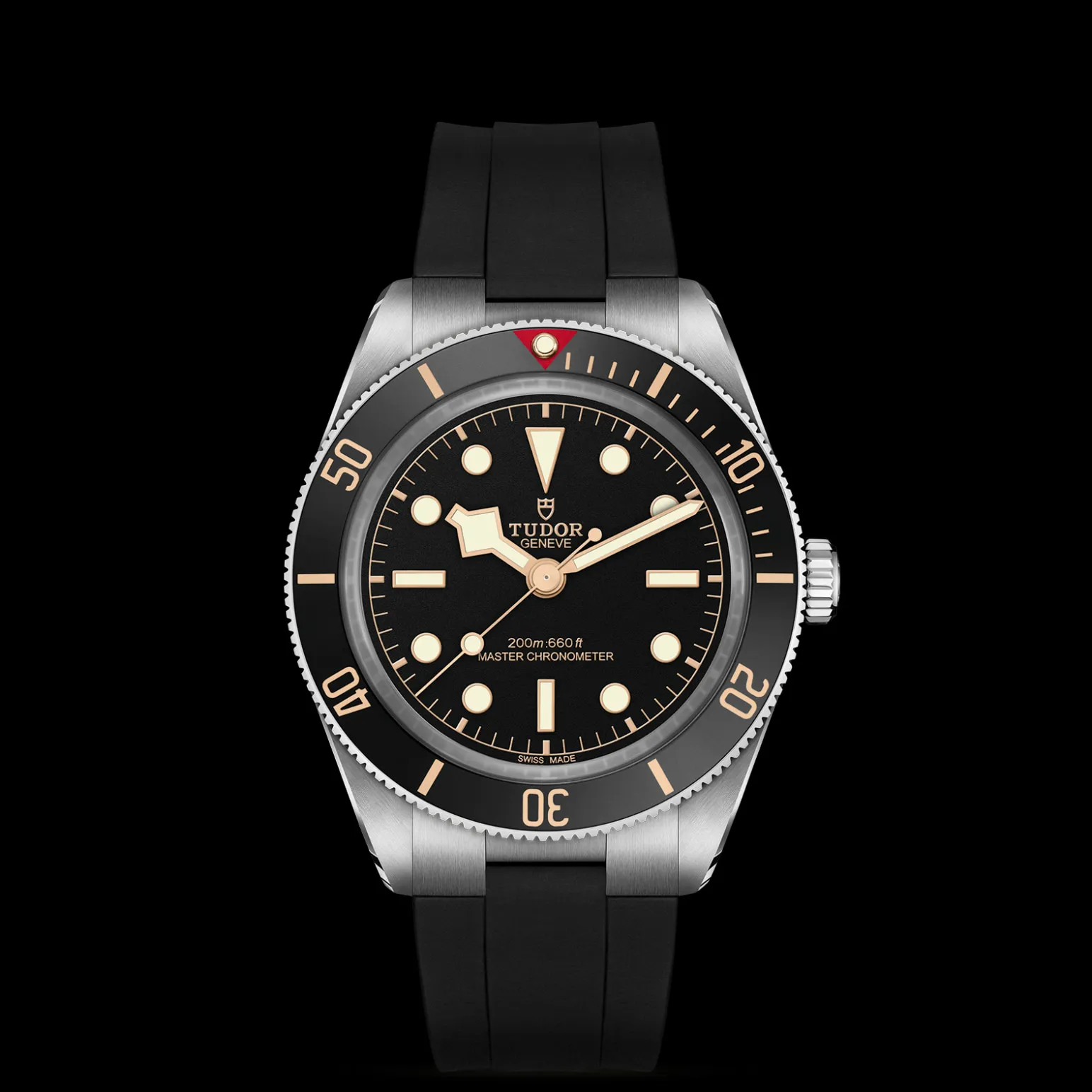 m7939a1a0nu-0003-upright_watch_black_background_zoomed_in | Brela Close-up of a Tudor diver's watch: black dial with gold luminous indices, unidirectional bezel, stainless steel case, and black rubber strap | Brela