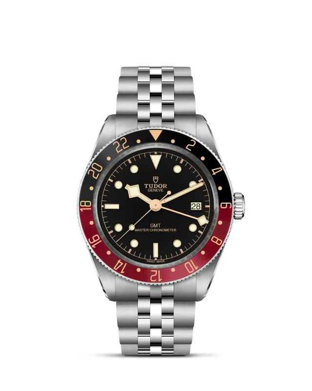 m7939g1a0nru-0003_upright-wh-std-grid | Brela | Brela Tudor GMT wristwatch with black dial, red and black bezel, and stainless steel bracelet; date window at 3 o'clock. | Brela | Brela