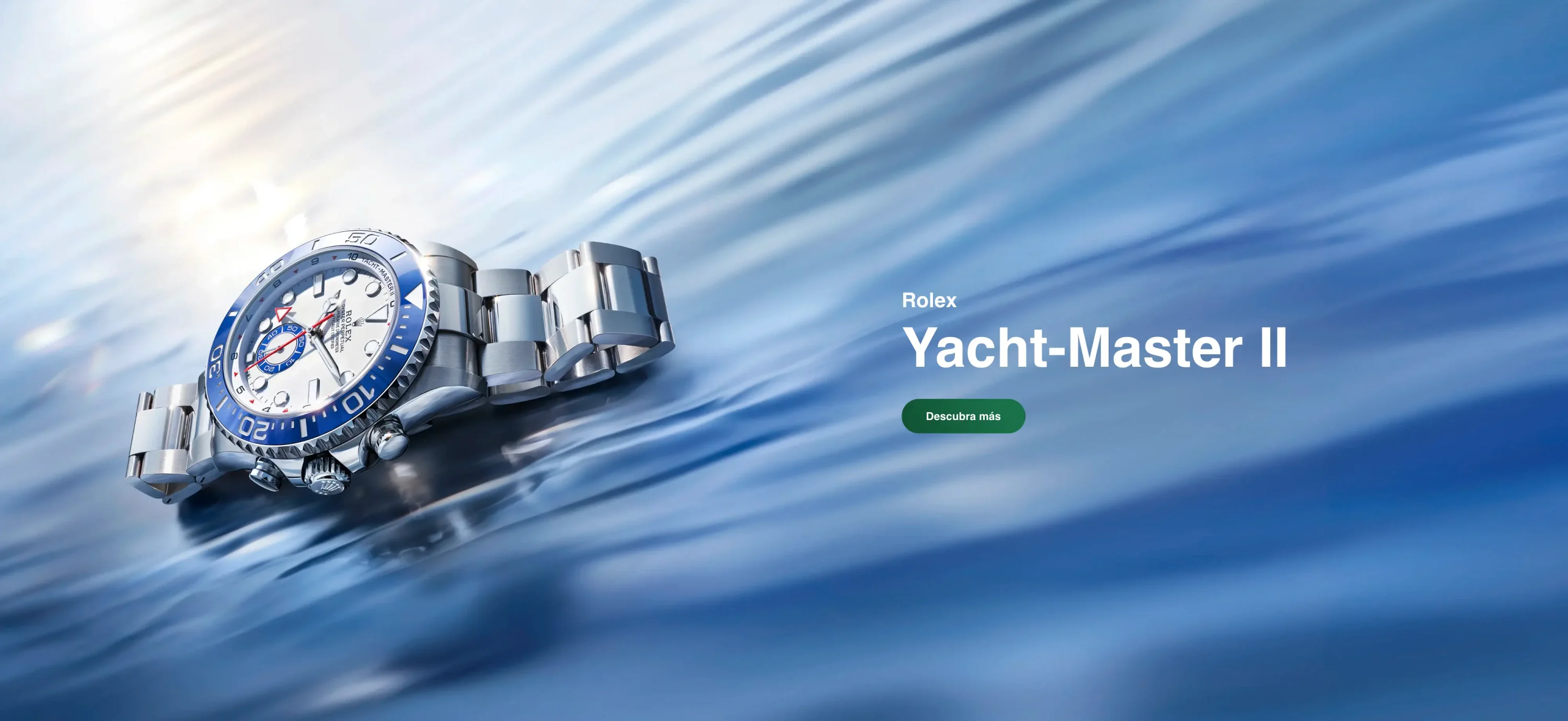 Promotional banner featuring a Rolex Yacht-Master II watch with a blue bezel on silver bracelet, set against a blue water background with a green 'Descubra más' button. | Brela