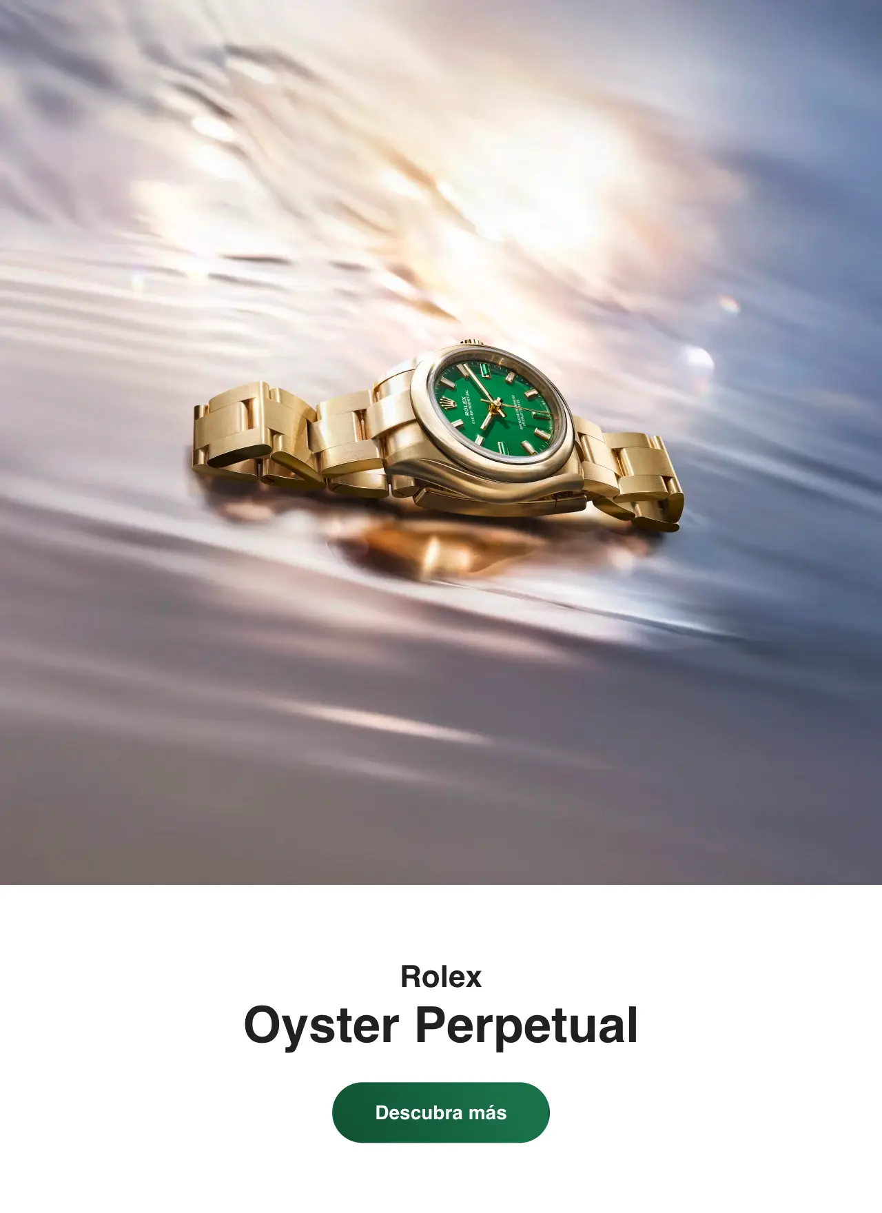 Gold Rolex watch with a green dial floating on water, reflecting light in a blurred backdrop (informational product image). | Brela