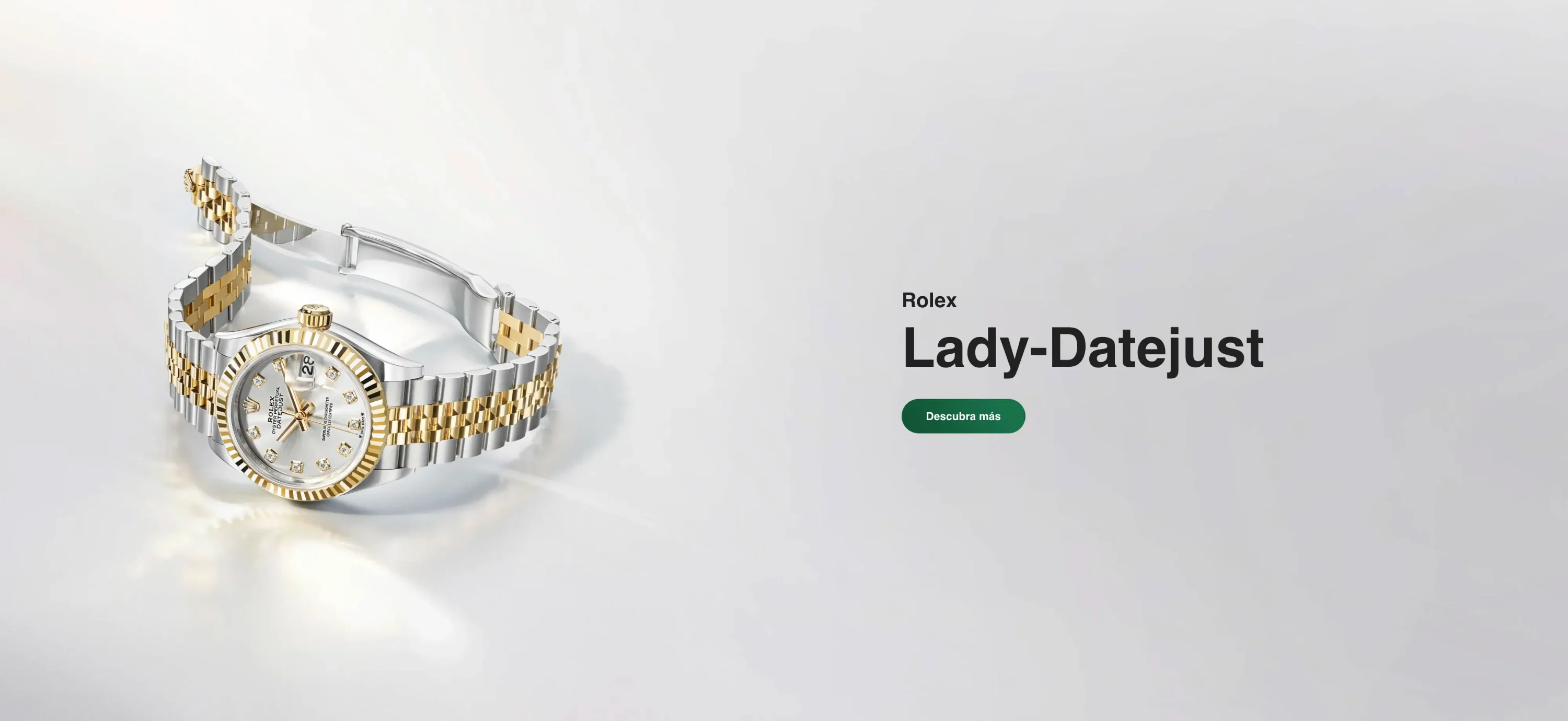 Two-tone Rolex Lady-Datejust wristwatch with diamond markers displayed on the left, beside a banner that says 'Rolex Lady-Datejust' with a green 'Descubra más' button. | Brela